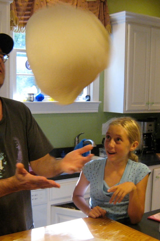 Throwing the pizza dough is impressive.