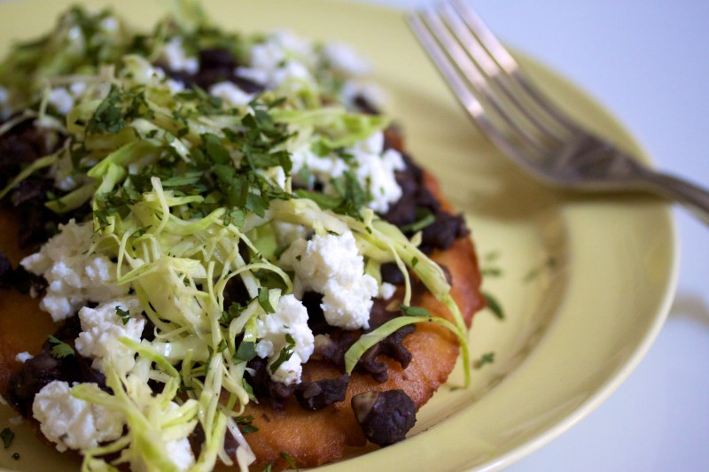 Salbutes with black beans, chipotle and tomatoes